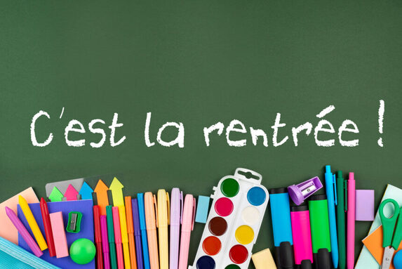 back-school-background-with-school-supplies-green-1-860x575.jpg